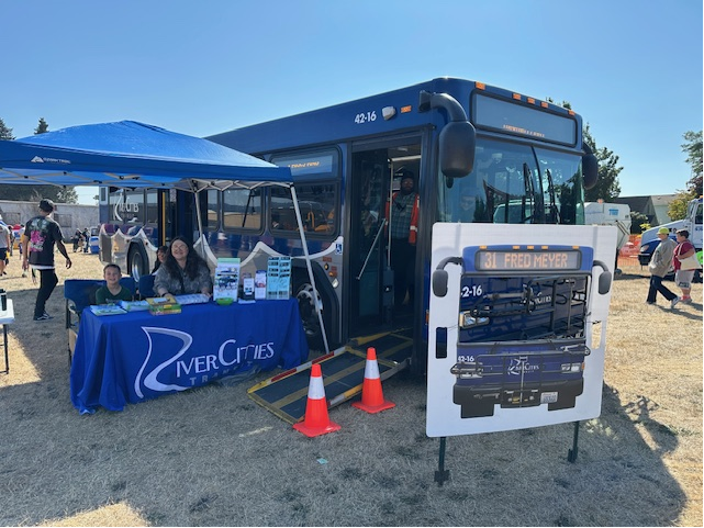 Picture of a young boy standing next to a very long rig with his hand on a tire that is almost twice his size. Caption reads: Extreme Machines. Let's get extreme! Free Family Event through the Parks and Recreation Department. September 19, 2026, at Cowlitz Co Expo Center
